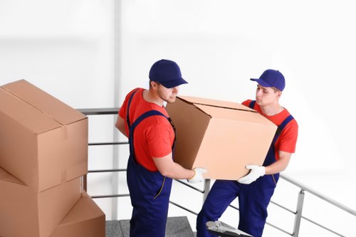 Office removals planning in Edgware with moving boxes and workplace setup