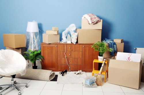 Moving team handling furniture and boxes during a local removal
