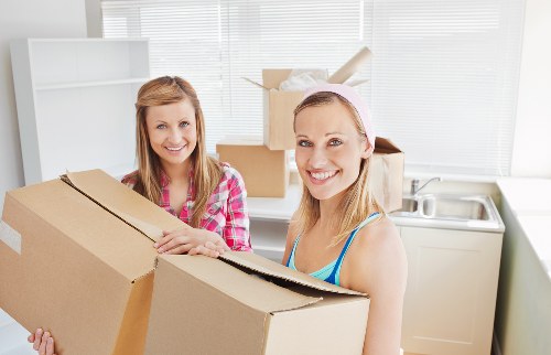 Organized self storage unit with boxes and furniture